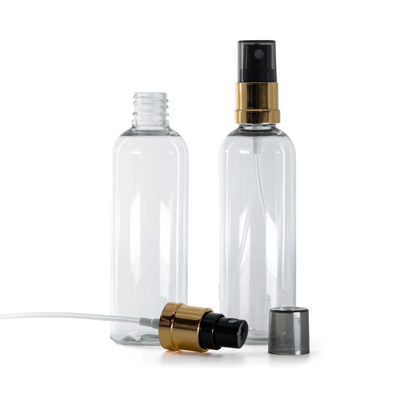 Flacon en plastique transparent, vaporisateur noir et or, surcapuchon fumé, 100 ml
