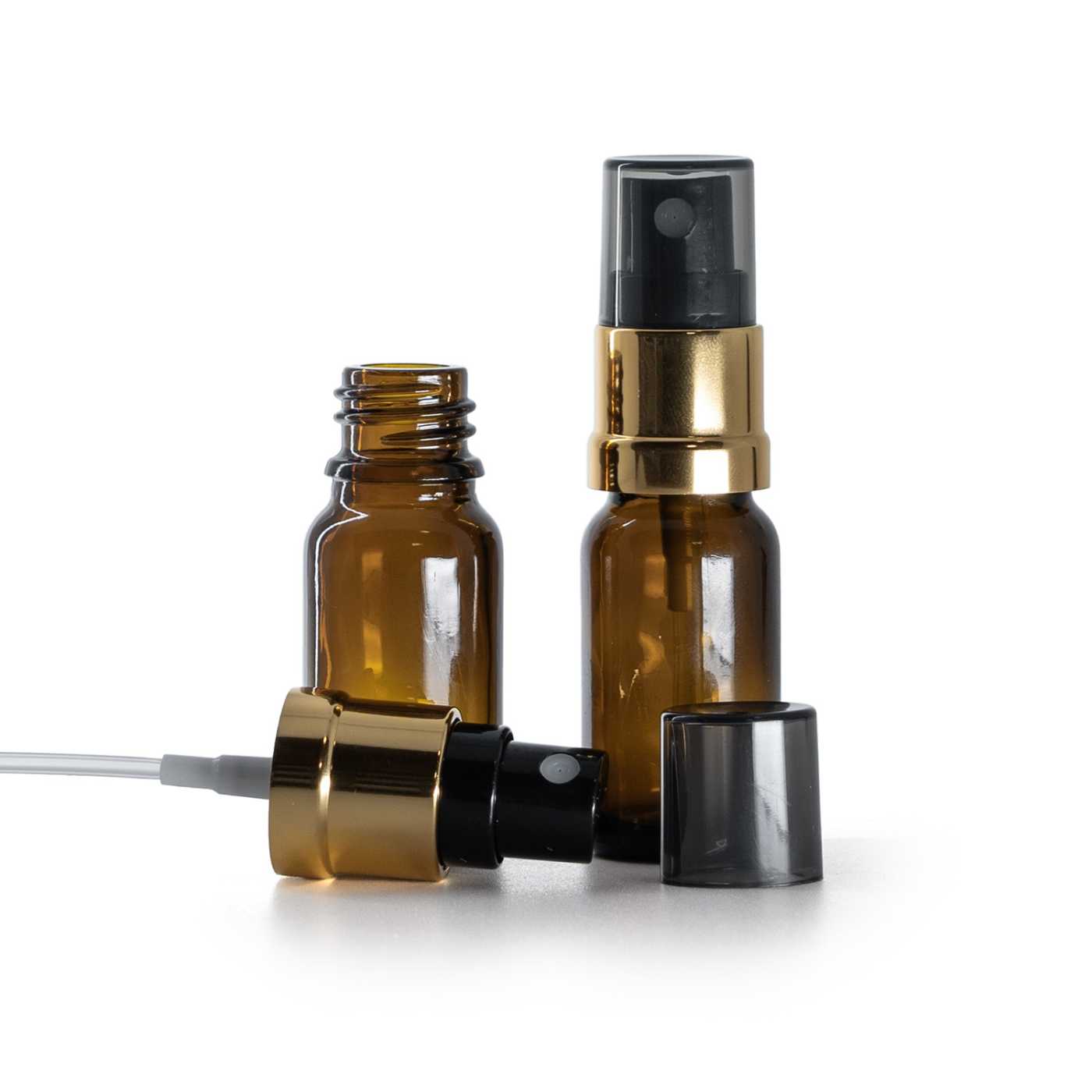 Sklenená liekovka, čierno-zlatý rozprašovač, dymový kryt, 10 ml