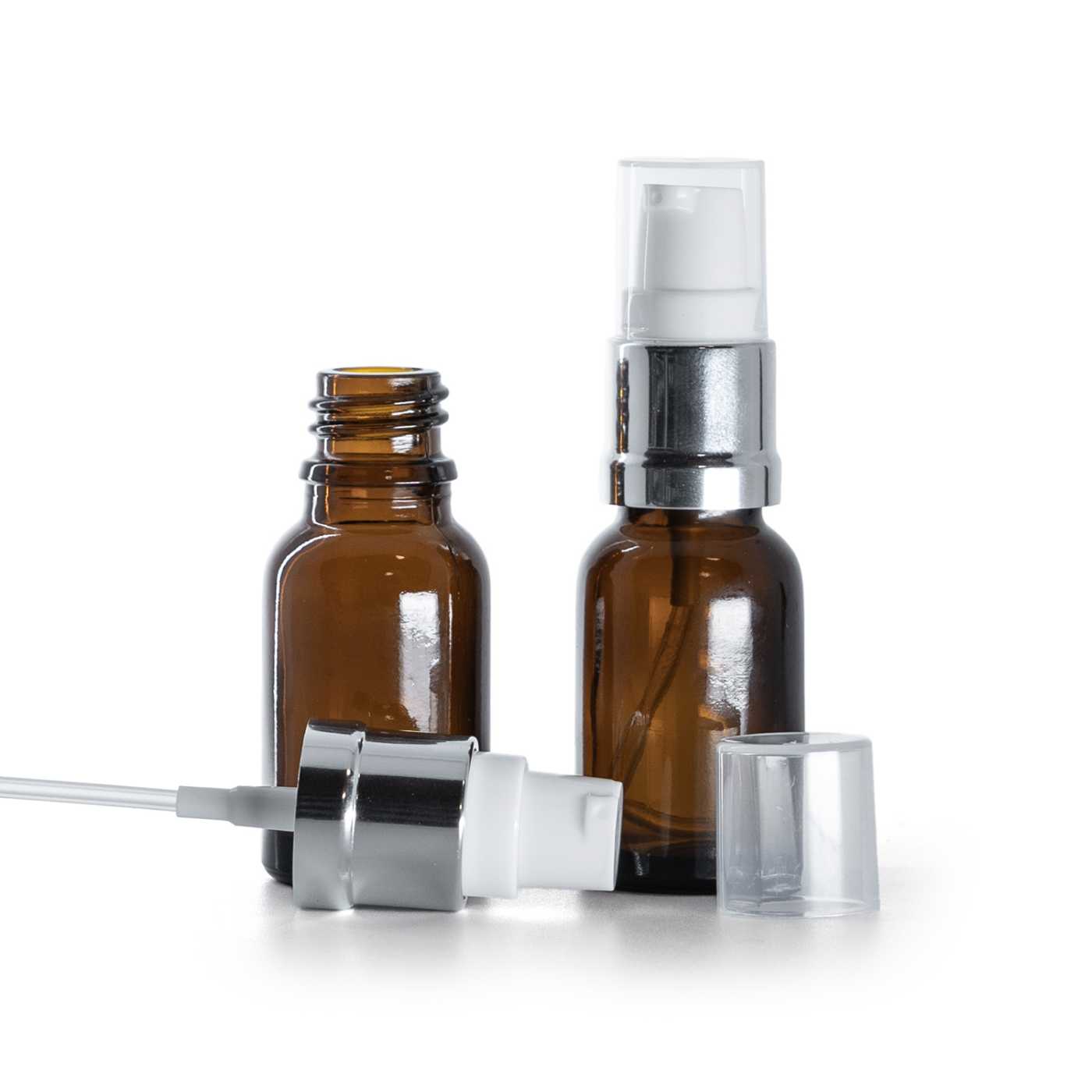 Hnědá skleněná lahvička s lesklým bílo-stříbrným dávkovačem, 15 ml