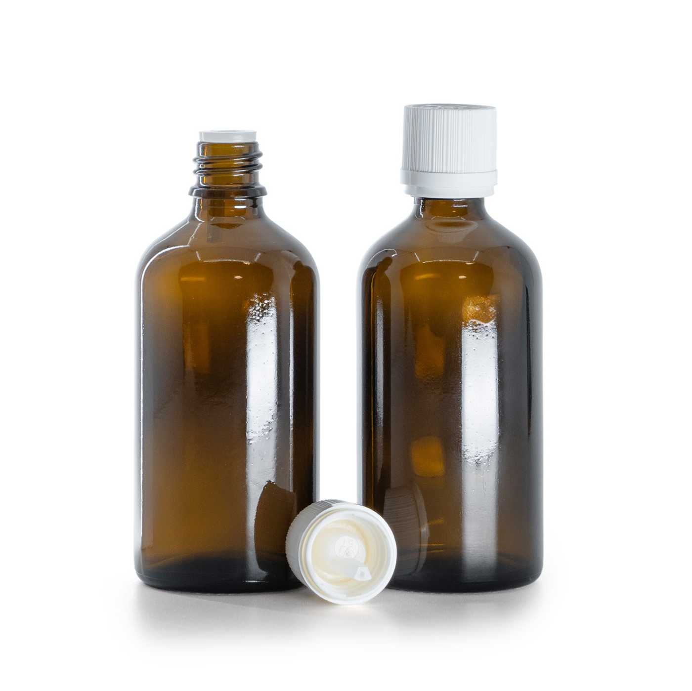 Sklenená fľaška, liekovka, biely vrúbkovaný vrchnák s poistkou, 100 ml