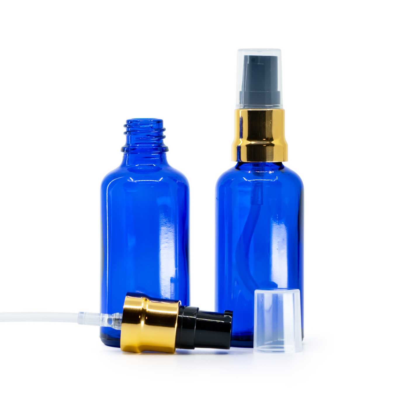 Blaue Glasflasche, schwarzer Glanzdosierer mit goldenen Akzenten und transparentem Überkappe, 50 ml