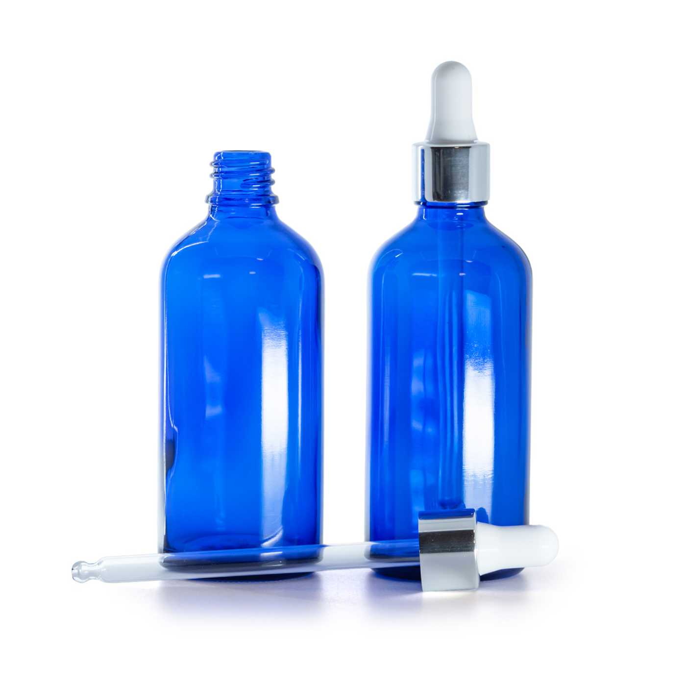 Blaue Glasflasche mit glänzender silberner Pipette, 100 ml
