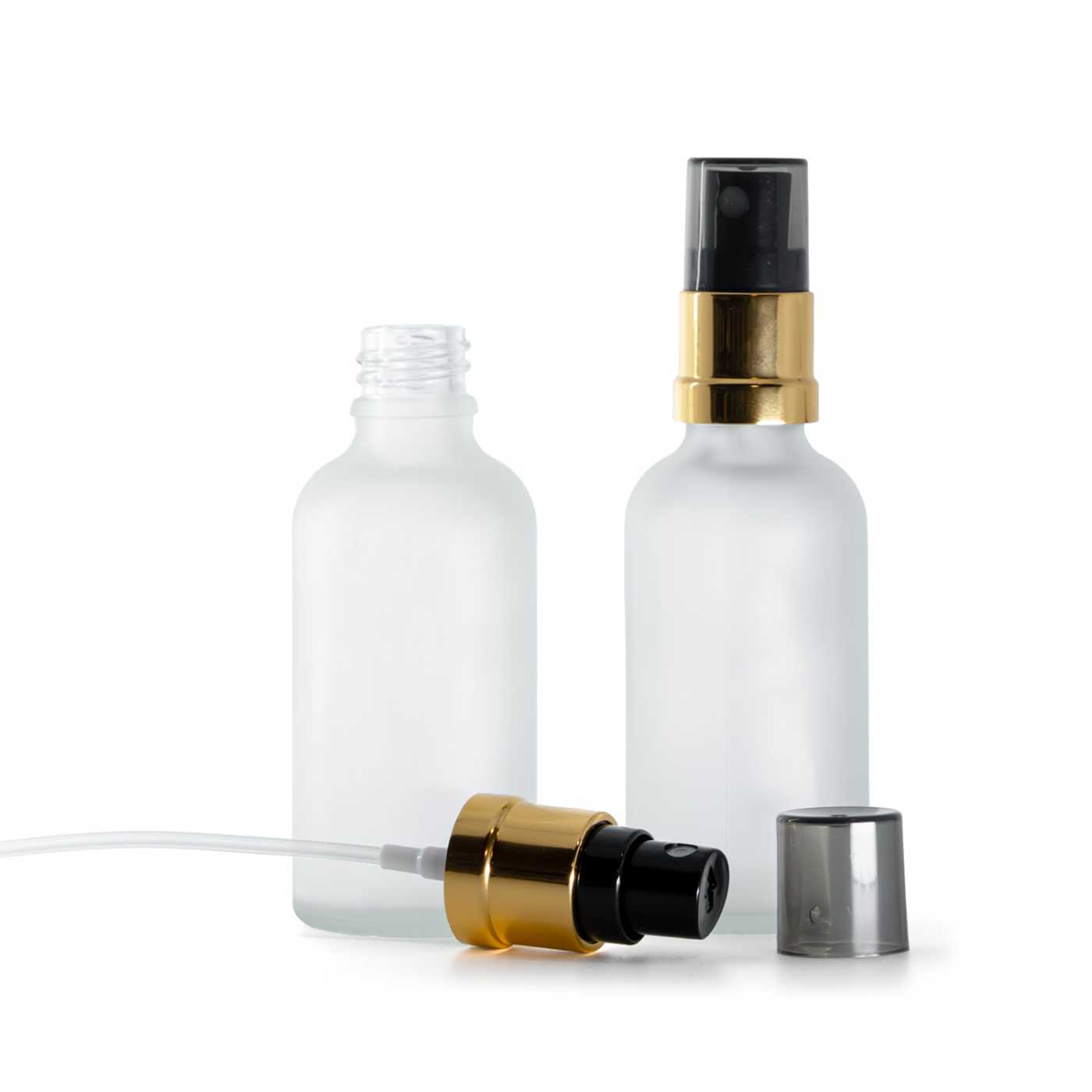 Butelka szklana, przezroczysta mleczna, czarno-złoty atomizer, przydymiony kapturek, 50 ml