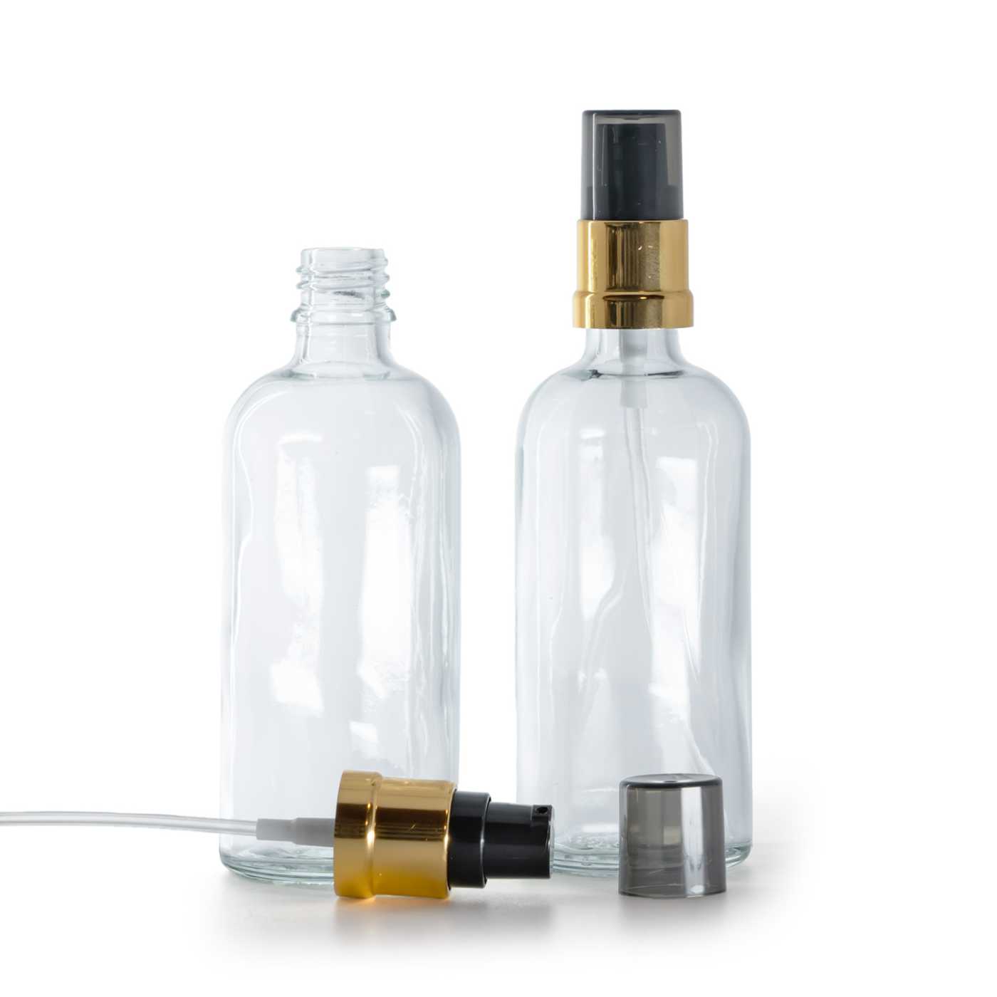 Sklenená fľaška, priehľadná, čierno-zlatý lesklý dávkovač s dymovým krytom, 100 ml