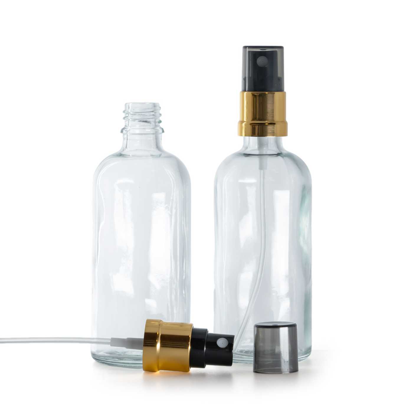 Frasco de vidrio transparente, pulverizador negro y dorado, sobretapa ahumada, 100 ml